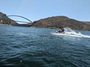 A person on water skis in the middle of the ocean.