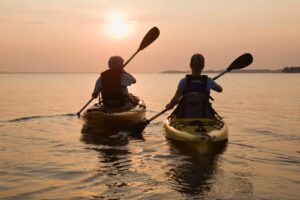 Two people in kayaks on a body of water